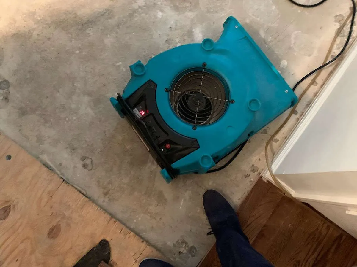 Air mover drying subfloor during Leak Detection & Repair in Parker